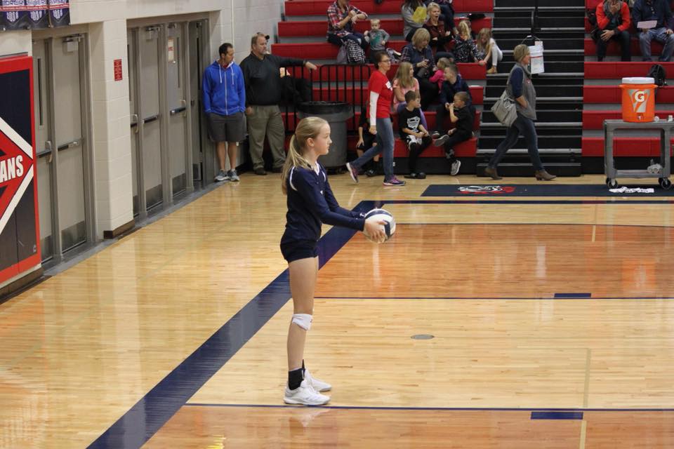 Ashlynn getting ready to serve