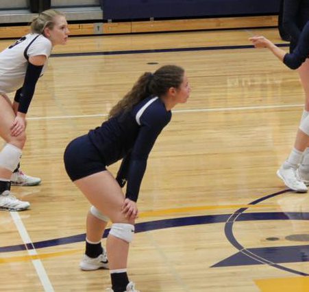 Megan down and ready for a serve