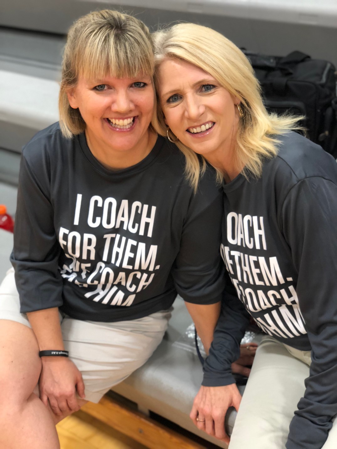 Stacy and Sue pose for a picture before a match