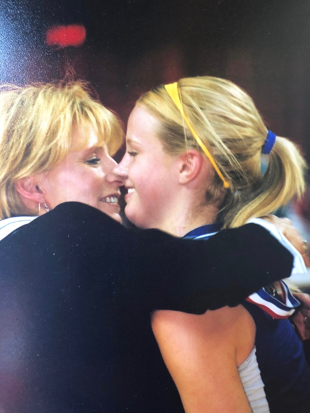 Sue hugs daughter Kelli after winning state in 2004
